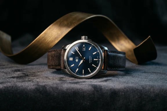 Luxury watch on dark velvet with single dramatic key light